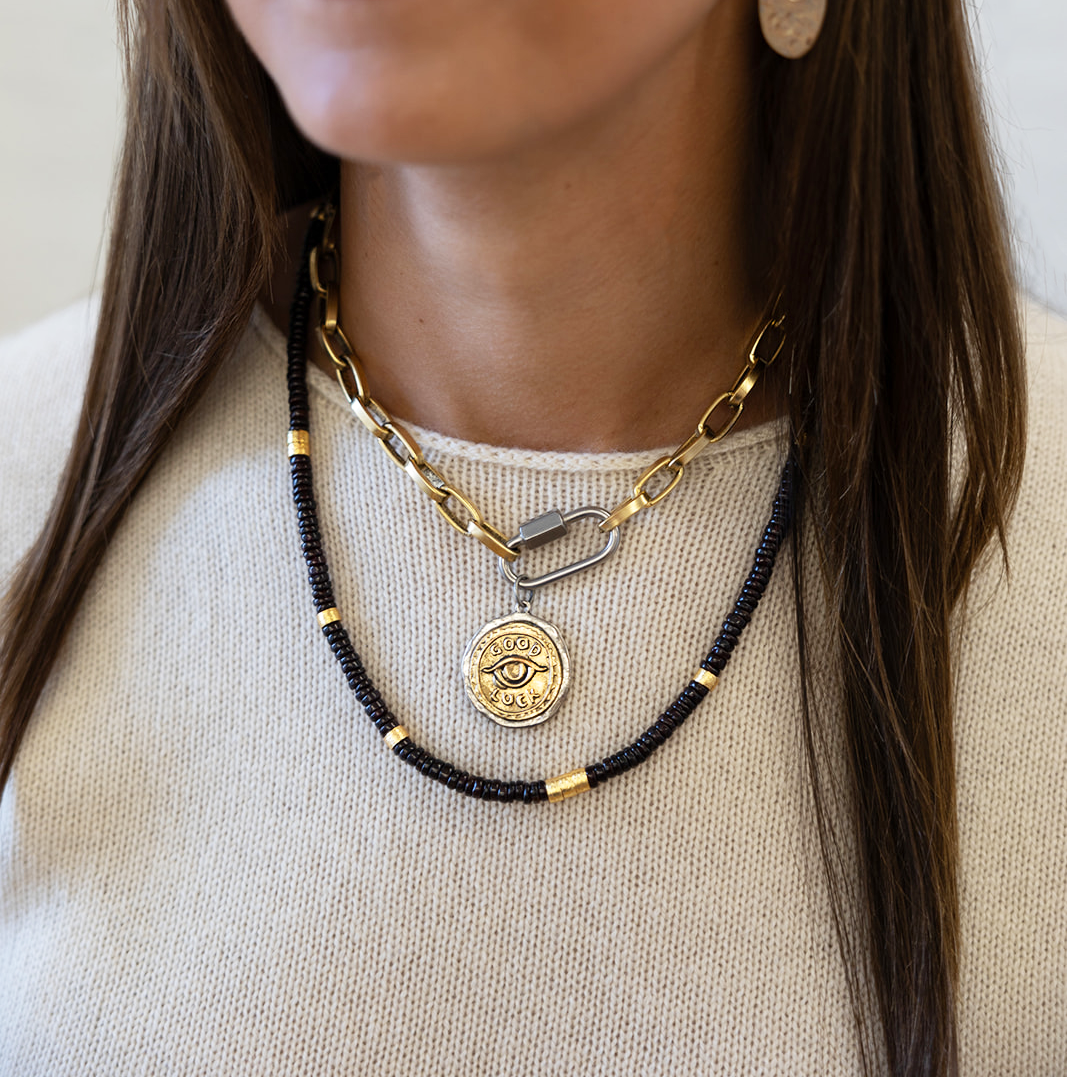 a garnet bead necklace with a chunky paperclip necklace with a coin