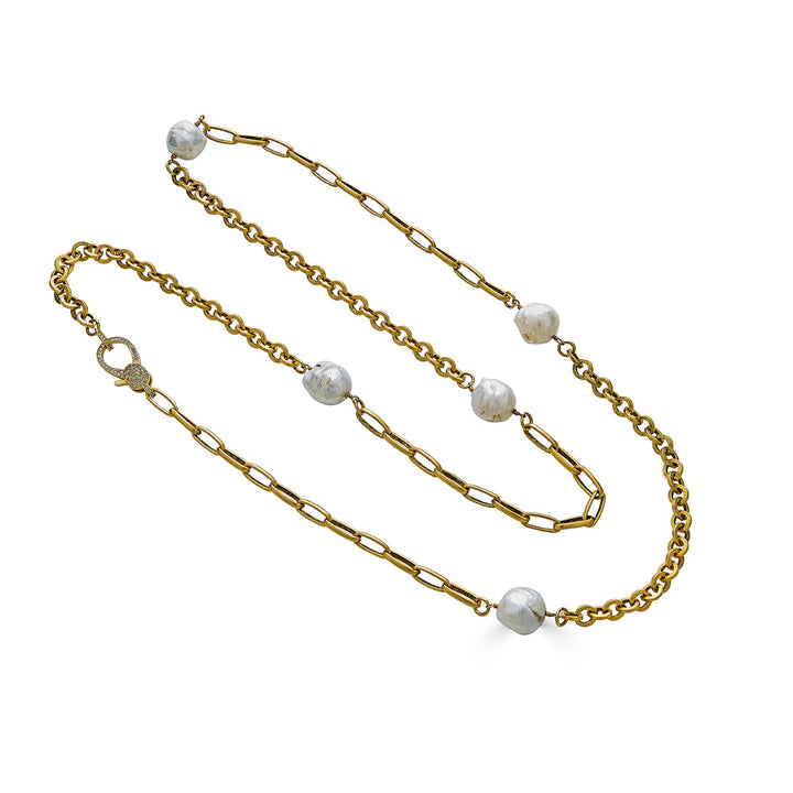 A baroque pearl gold chain necklace with pave clasp.