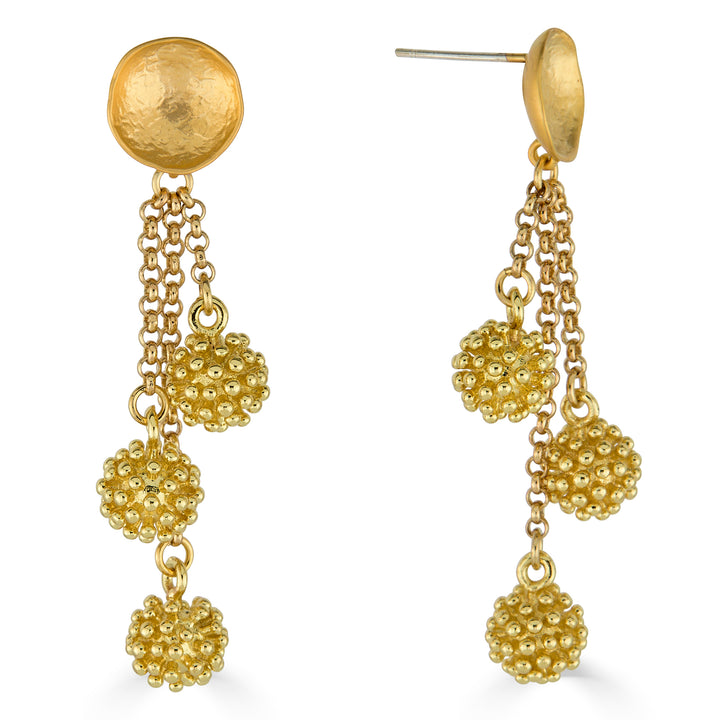 Gold drop earrings with hammered disc tops, cascading chains, and textured cluster bead charms.