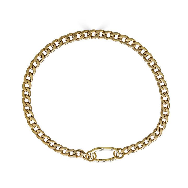 a matte gold curb chain necklace with oval pave clasp