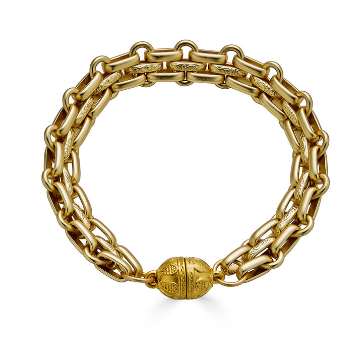 A matte gold flat link bracelet with magnetic gold clasp.
