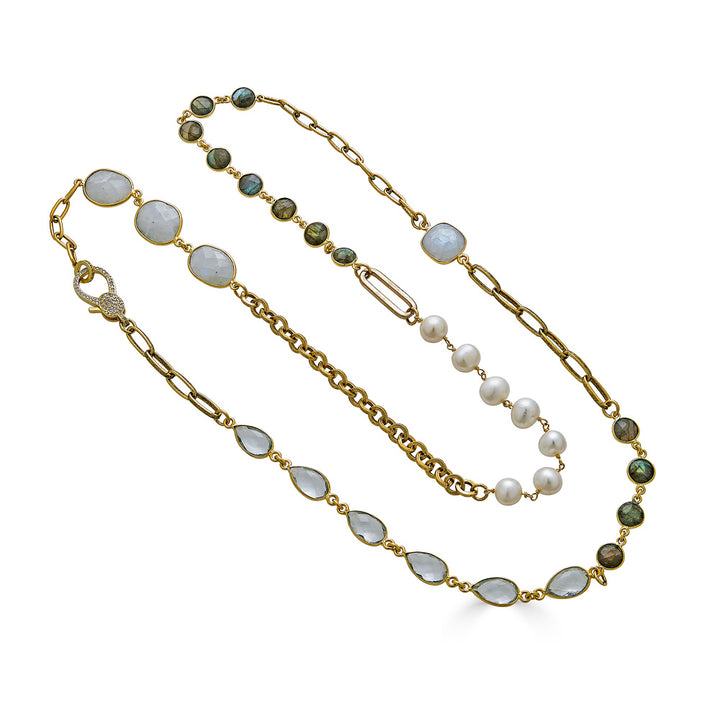 A gold mixed gemstone necklace with moonstones, labradorite, crystals, and pearls.