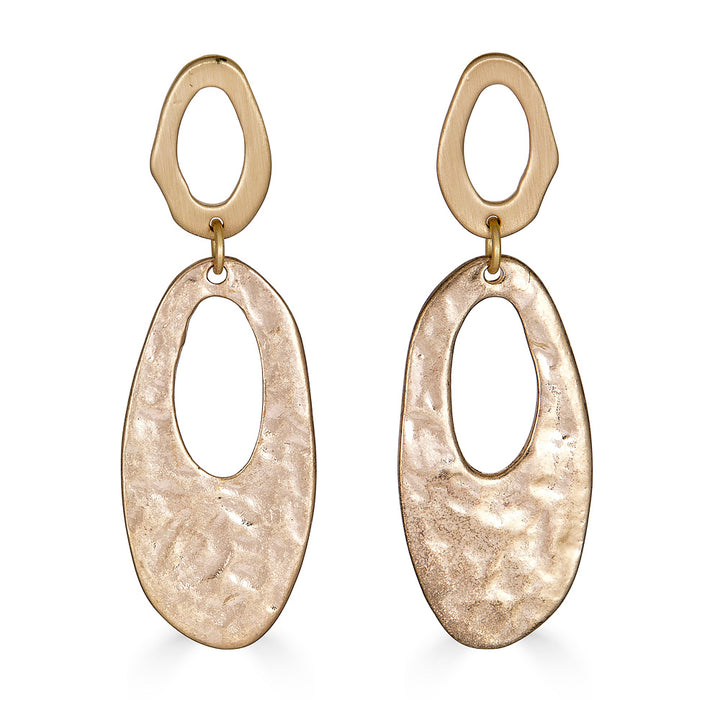 An oval hammered dangle earring on oval cutout posts.