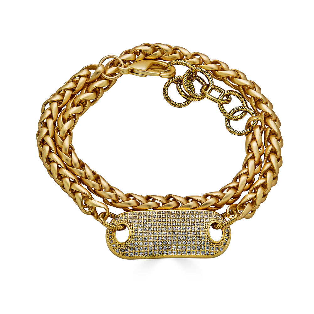 A double wrap matte gold bracelet with pave connector.