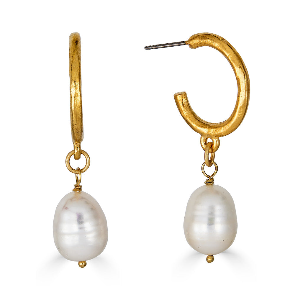 A pair of baroque pearl earrings on gold ear loops.