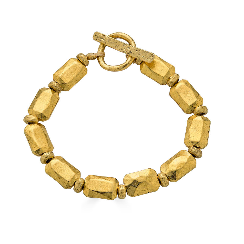 Bracelet featuring faceted rectangular gold beads with matte finish and toggle clasp.