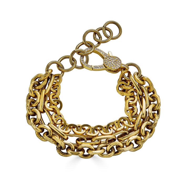 A three strand gold bracelet with pave lobster clasp.