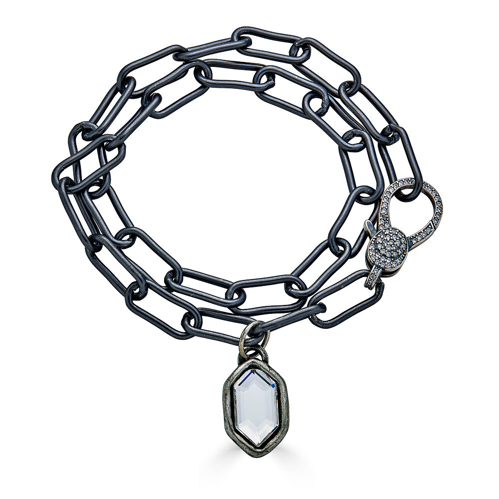 A double wrap silver paperclip chainlink bracelet with a marquis charm.