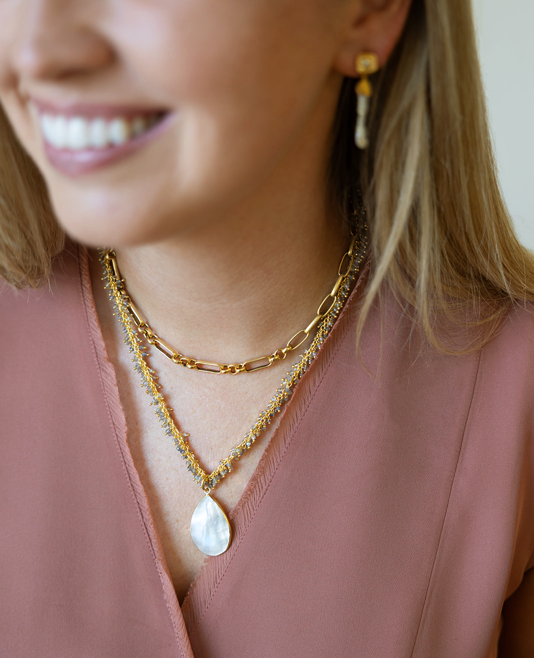 A labradorite drizzle necklace with a pearl pendant