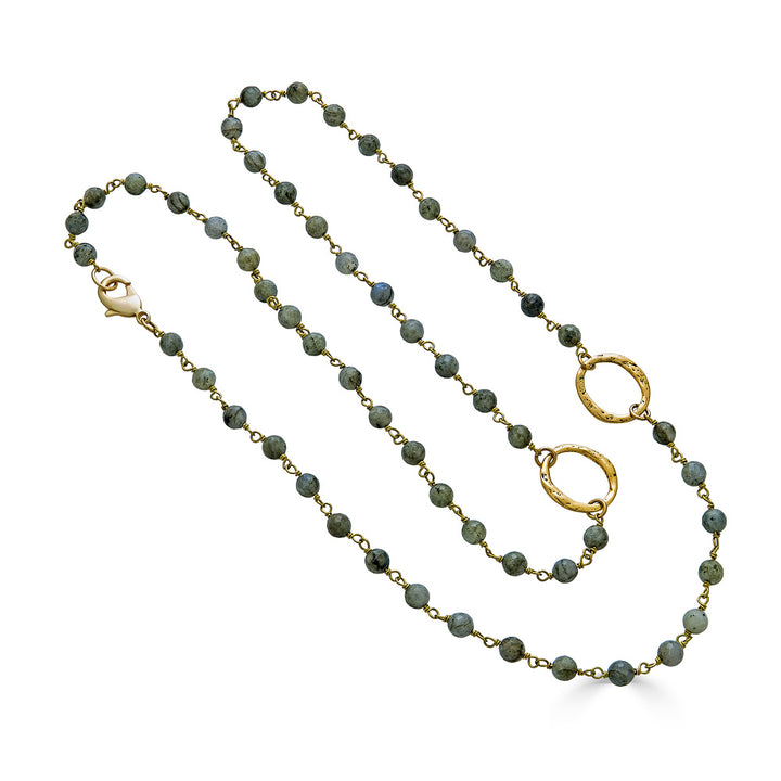 A labradorite gemstone gold necklace with circle connectors.