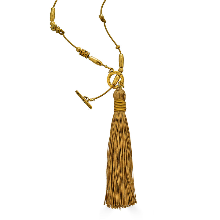 Handmade gold tassel necklace with organic bead accents and silk tassel detail