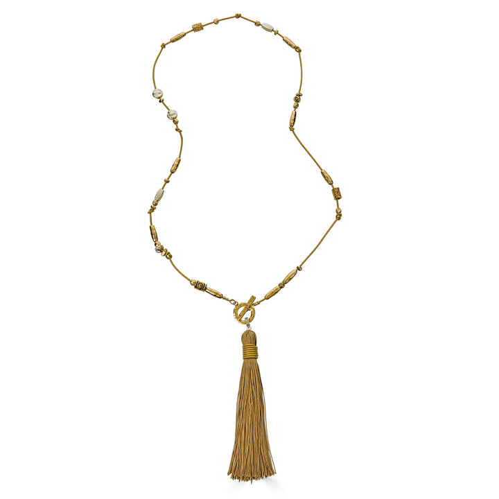 Handmade gold tassel necklace with organic bead accents and silk tassel detail