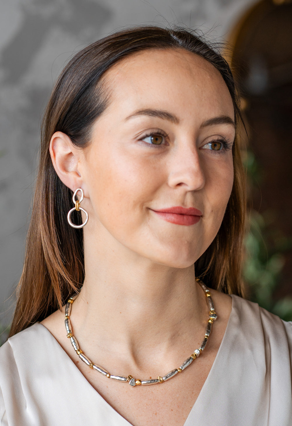Mixed metal necklace with organic gold and silver-toned beads.