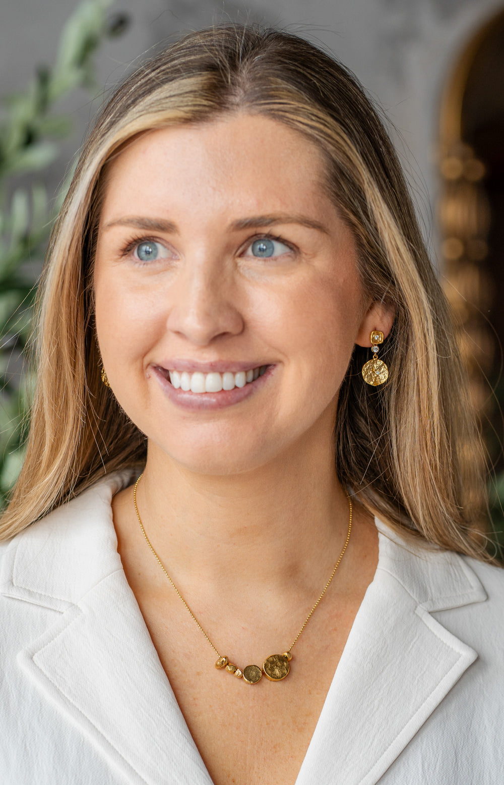 Gold necklace with asymmetrical round beads on a fine ball chain