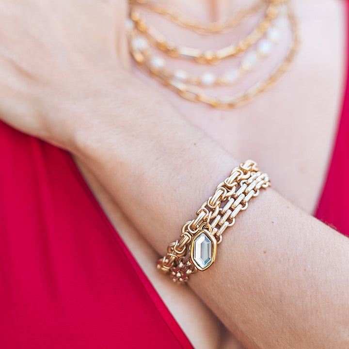 A matte gold flat link bracelet with magnetic gold clasp.