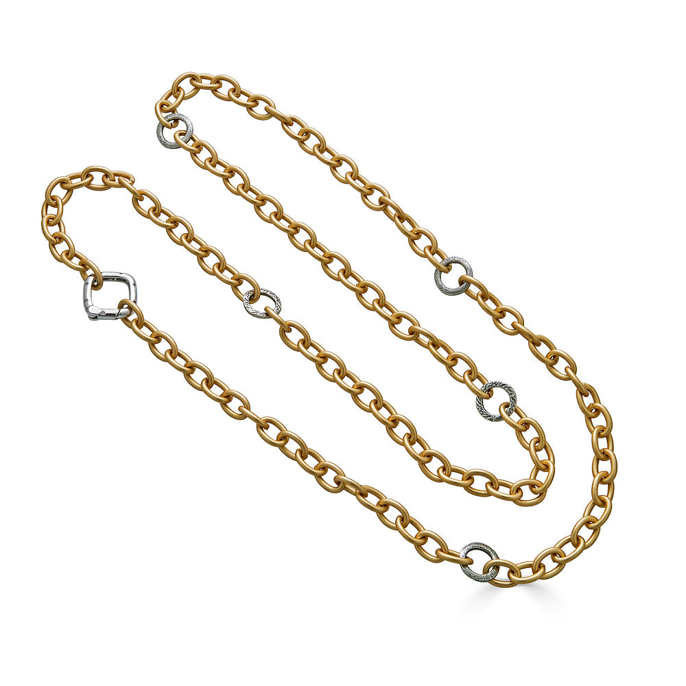 A matte gold layering chainlink necklace with silver accents and square clasp.