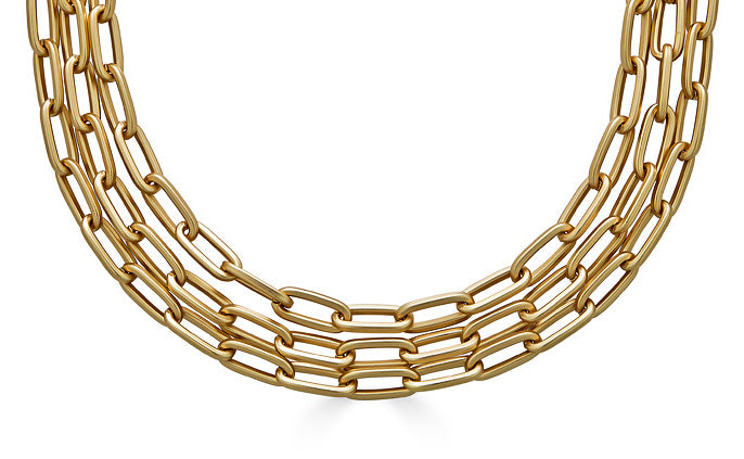 A three strand matte gold paperclip chain necklace.