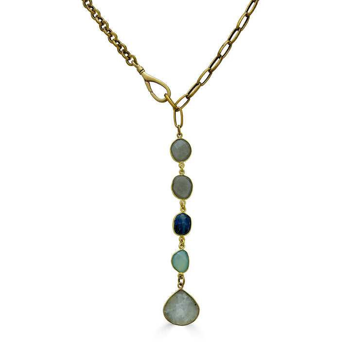 A mixed gemstone necklace with moonstone, kyanite and aquamarine stones with a moonstone pendant