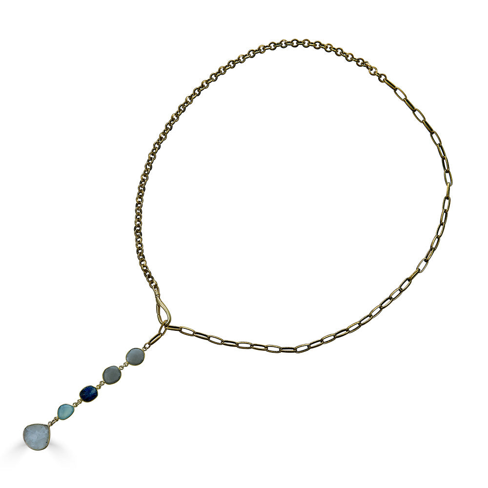 A mixed gemstone necklace with moonstone, kyanite and aquamarine stones with a moonstone pendant