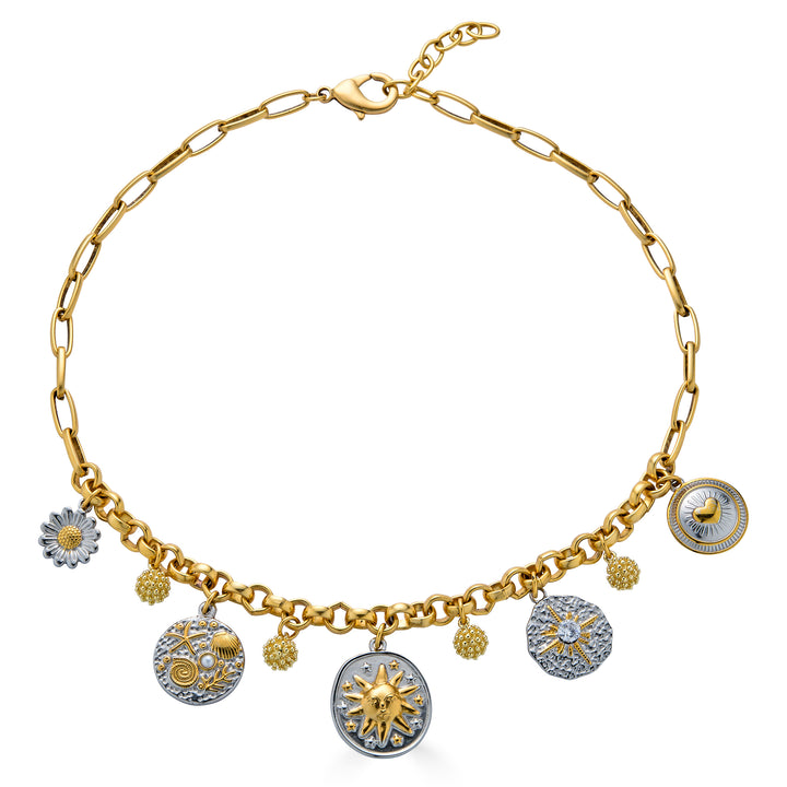 Mixed metal charm necklace with celestial, floral, heart, and ocean inspired charms hanging from a gold chain necklace.