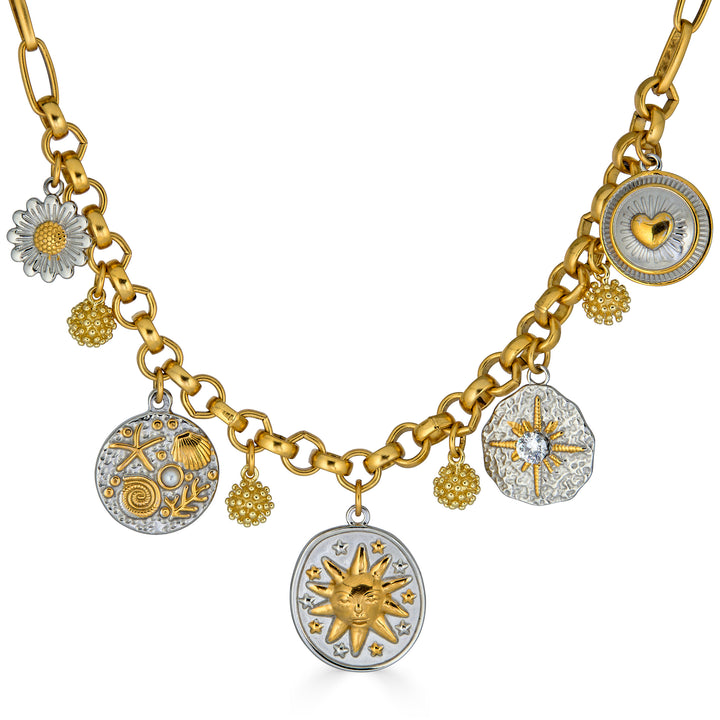 Mixed metal charm necklace with celestial, floral, heart, and ocean inspired charms hanging from a gold chain necklace.