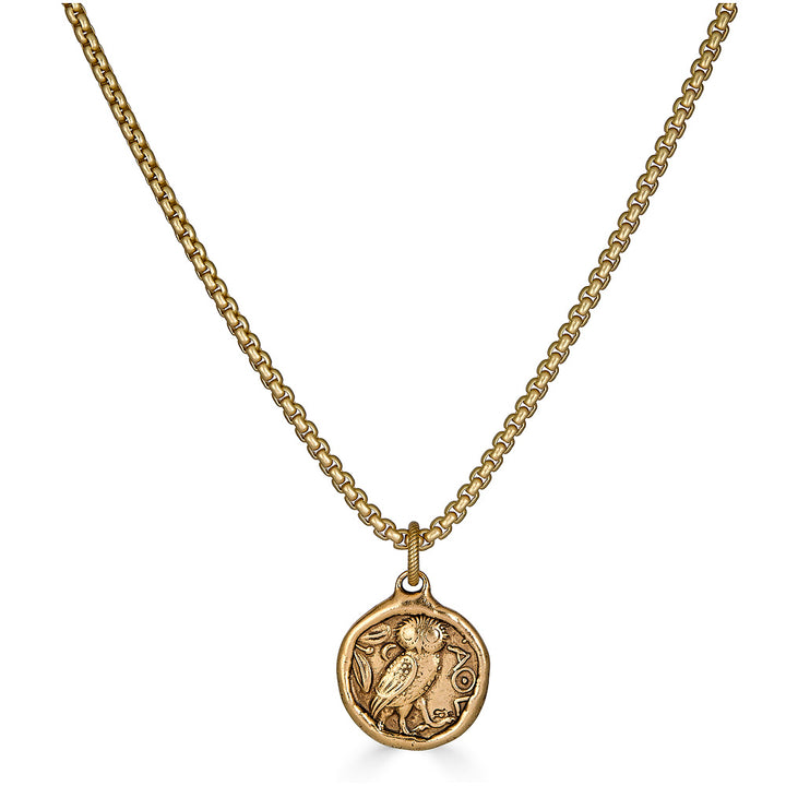 A vintage inspired two sided coin on a matte gold box chain