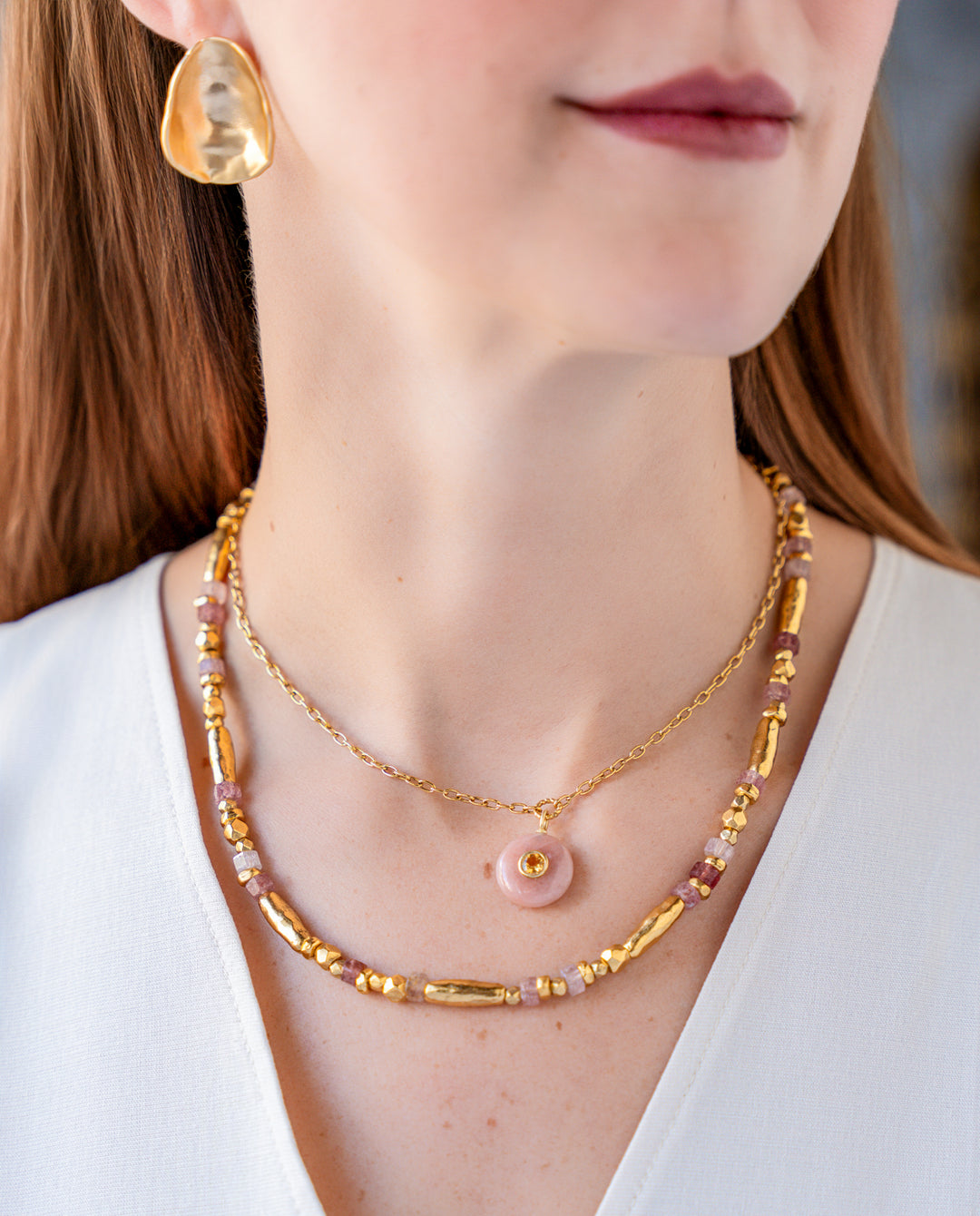 Necklace with pink strawberry quartz beads and organic gold-tone beads in an alternating organic pattern.