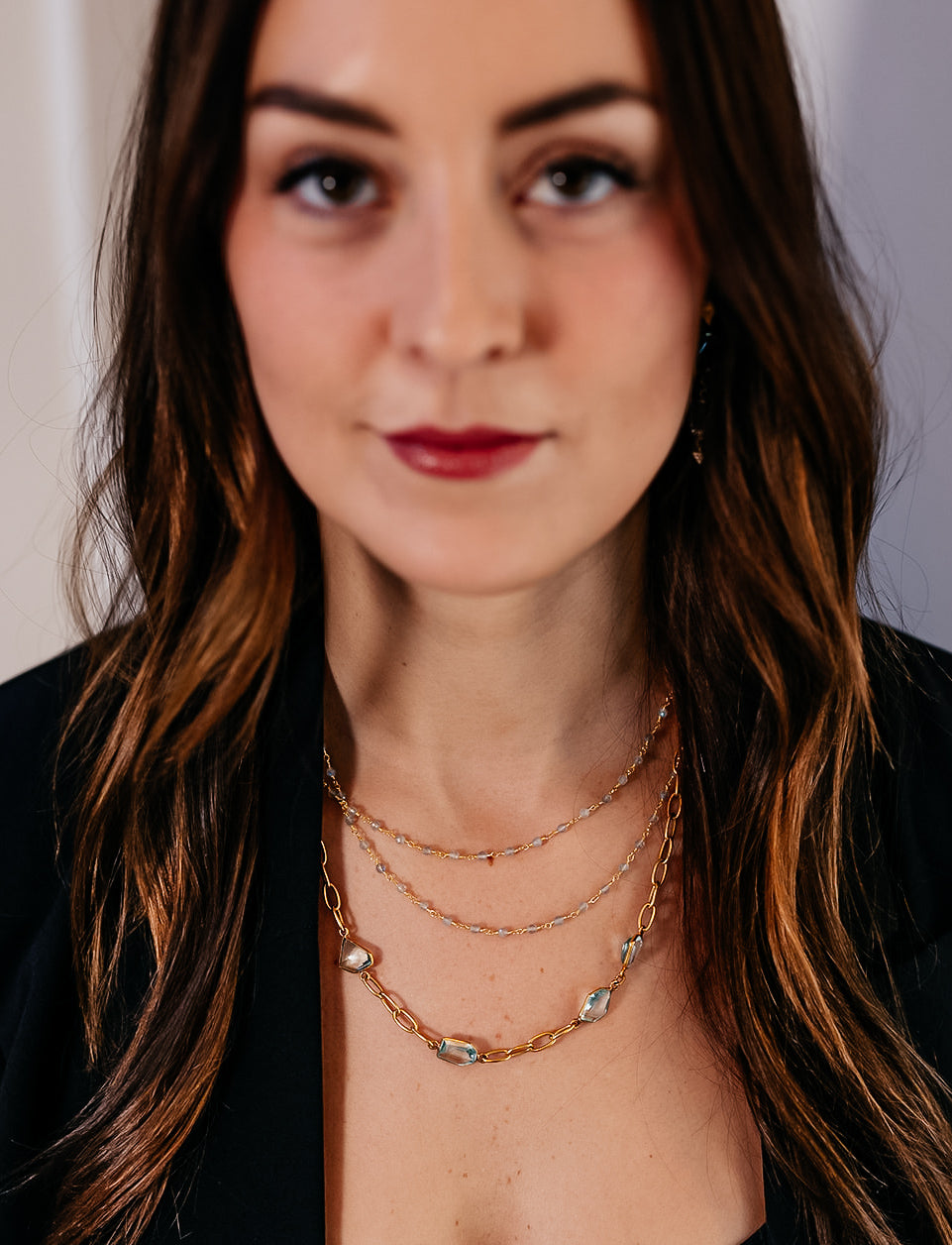 A model wearing a delicate two strand labradorite bead necklace.