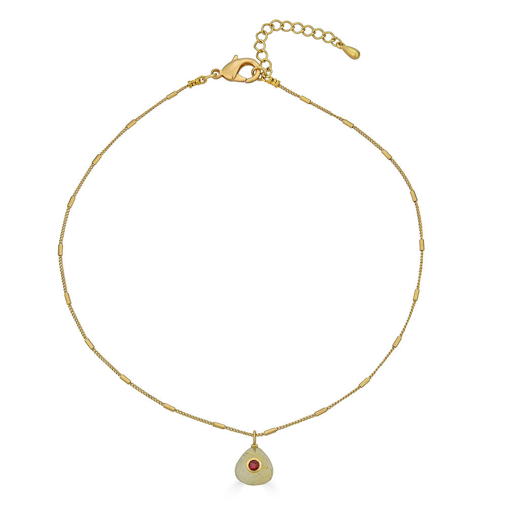 Gold chain necklace with a teardrop-shaped rutilated quartz pendant featuring a deep red garnet inlay