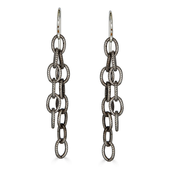 A pair of silver two strand chain earrings.