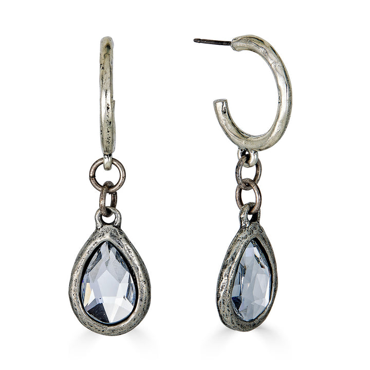 A pair of silver teardrop crystal hoop earrings.