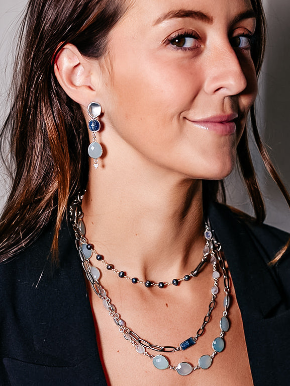A silver mixed gemstone necklace with chalcedony, kyanite, moonstone and pearls.