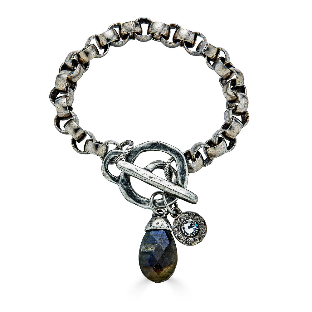 A silver chunky rolo chain bracelet with a labradorite charm and toggle clasp.