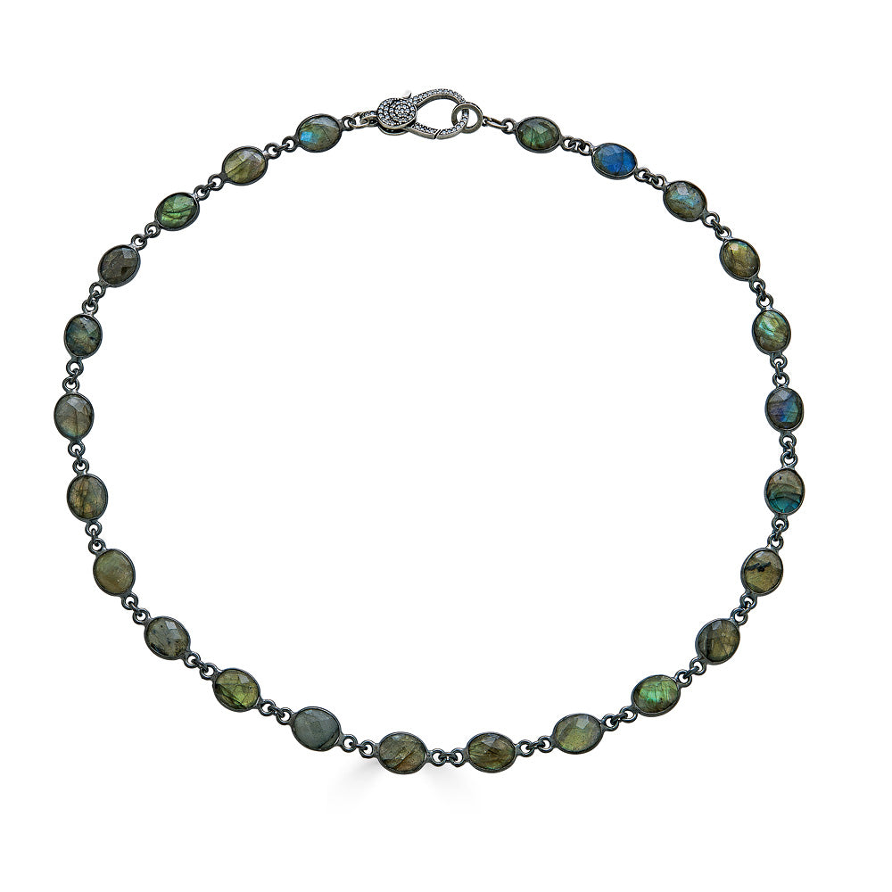 A bezel set labradorite necklace with pave clasp.