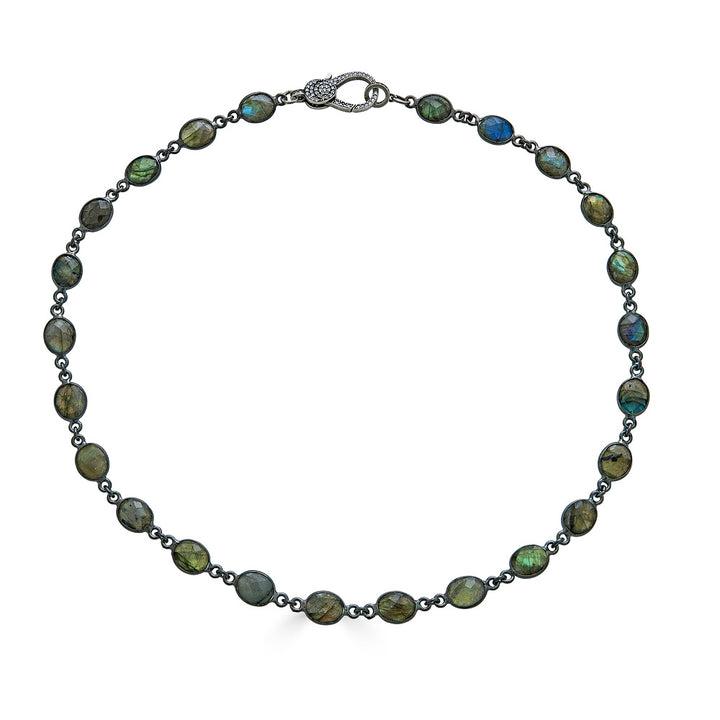 A bezel set labradorite necklace with pave clasp.