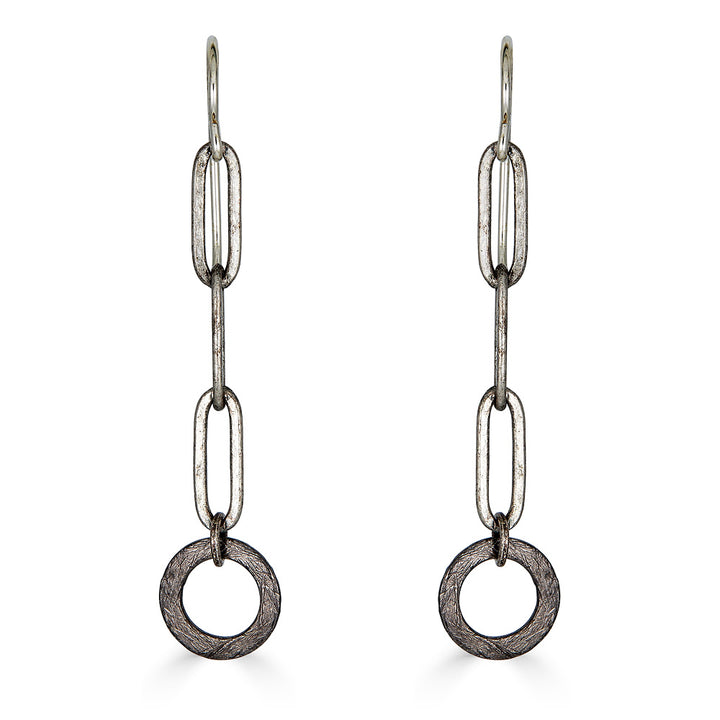 A pair of silver paperclip chain earrings with hoop detail.