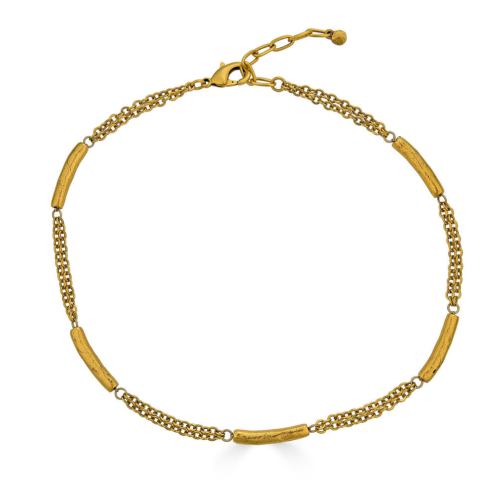 Gold-plated necklace with textured tube beads spaced along a double chain.