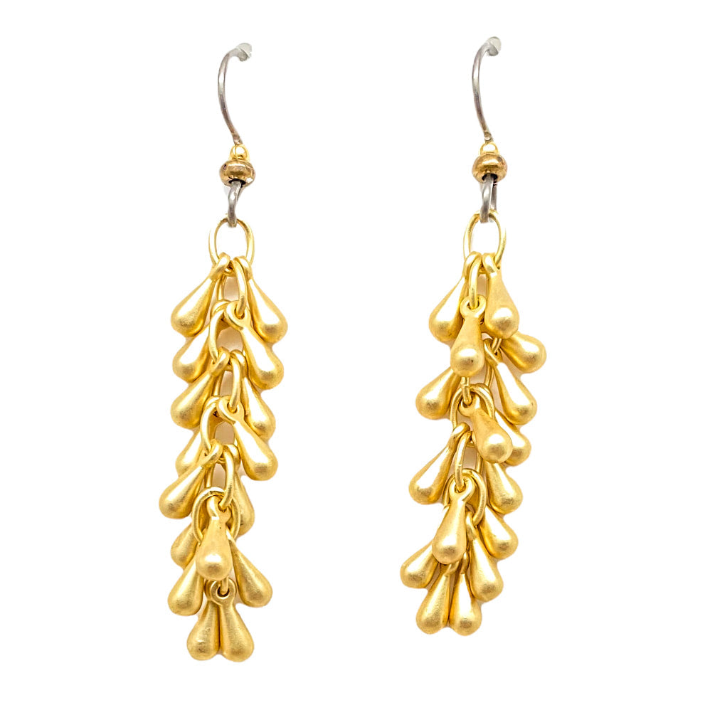 A pair of gold fireworks drop earrings.