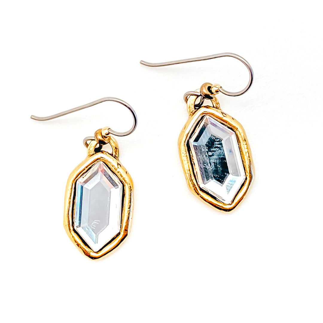 A pair of gold elongated hexagon crystal earrings.