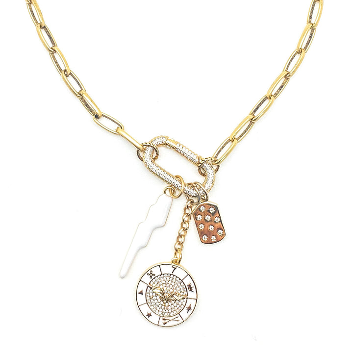 A gold paperclip chainlink necklace with white lightning, wing wheel, and star charms on a pave spring clasp.