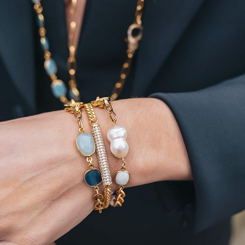 A mixed chain bracelet with baroque pearls and moonstone and a pave clasp