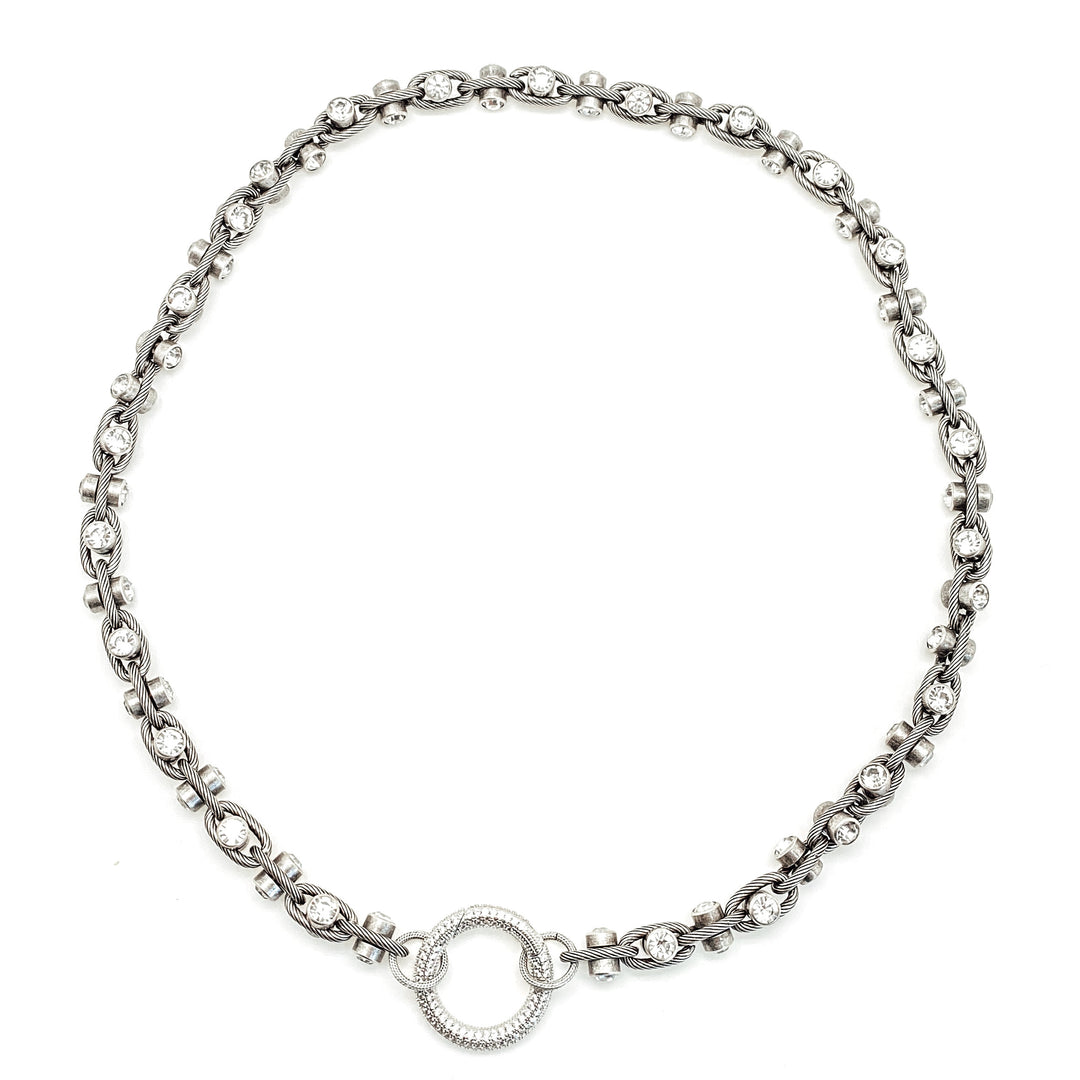 A triple wrap crystal chainlink necklace with a round pave clasp.