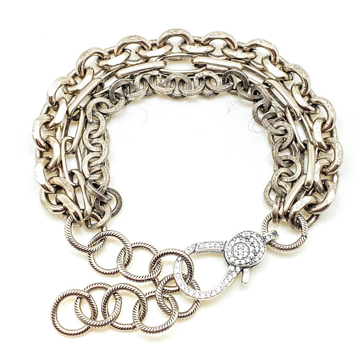 A three strand silver bracelet with pave lobster clasp.